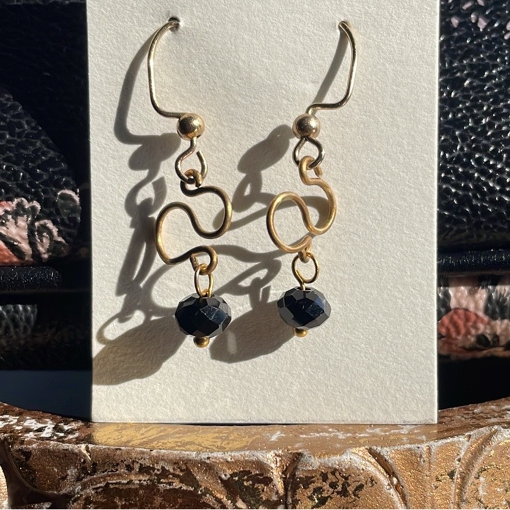Elegant Gold Infinity Earrings with Black Beads